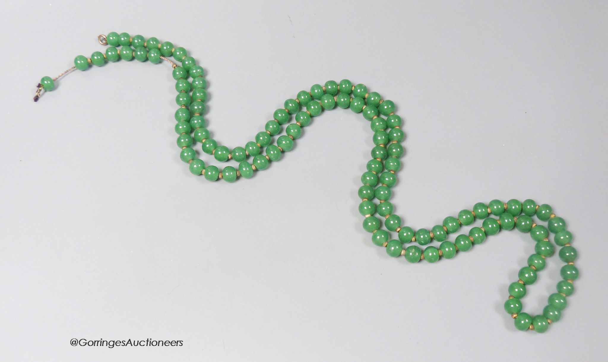 A single strand simulated jade bead necklace, 114cm.